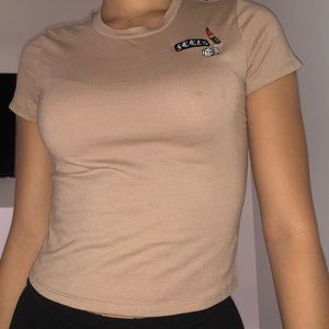 Tan “Feels” shirt with patchwork